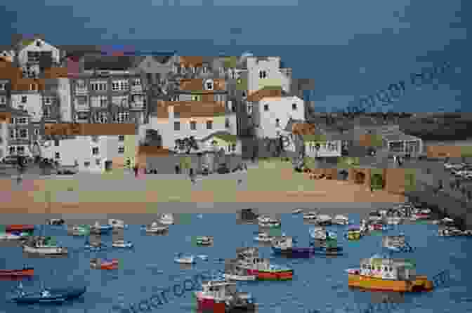 A Colorful View Of The Harbor In St Ives, Cornwall, With Its Brightly Painted Houses And Boats Bobbing On The Water. Maritime Archaeology On Dry Land: Special Sites Along The Coasts Of Britain And Ireland From The First Farmers To The Atlantic Bronze Age